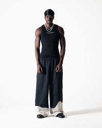 ASYMMETRICAL SWEATPANTS - BLACK / CREAM